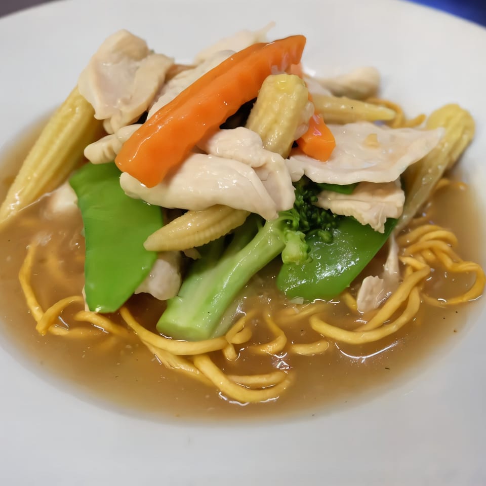 Thai Nakornping's chicken and vegetable stir-fry with noodles in a savory sauce.