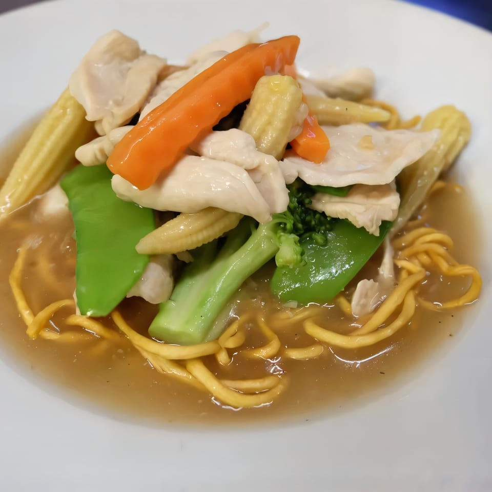 Thai Nakornping's chicken and vegetable stir-fry with noodles in a savory sauce.